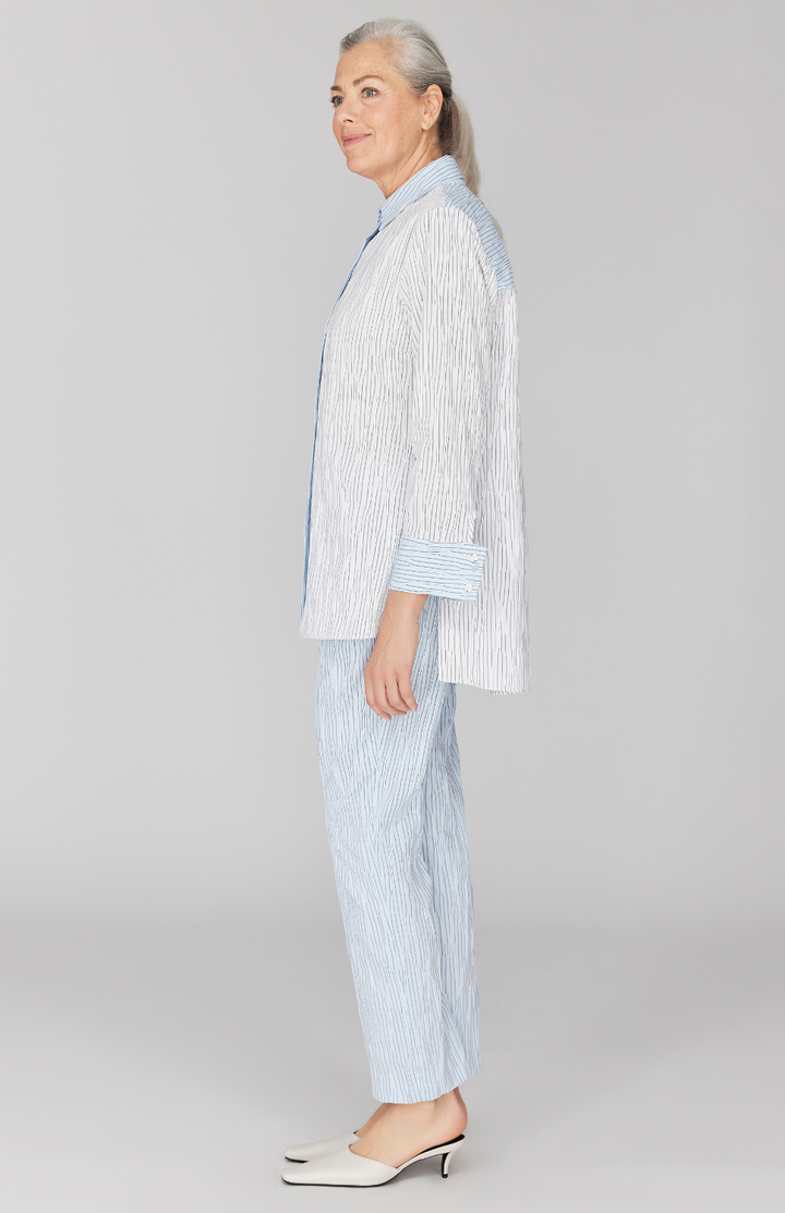 Fabienne is 5' 9" and wearing Blue in size XS.