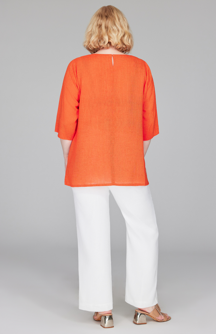 Molly is 5'9" and wearing a size L in Tangerine.