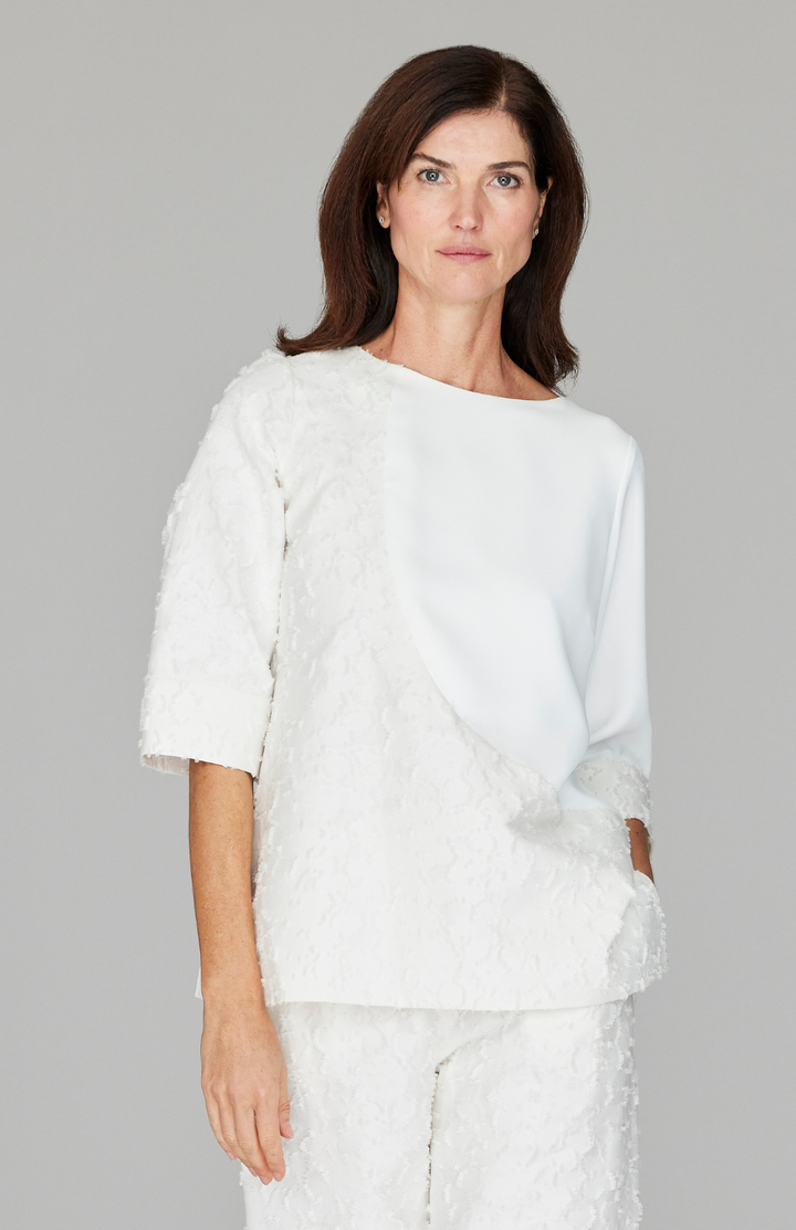 Ekaterina is 5'10" and wearing a size XS in Pearl.