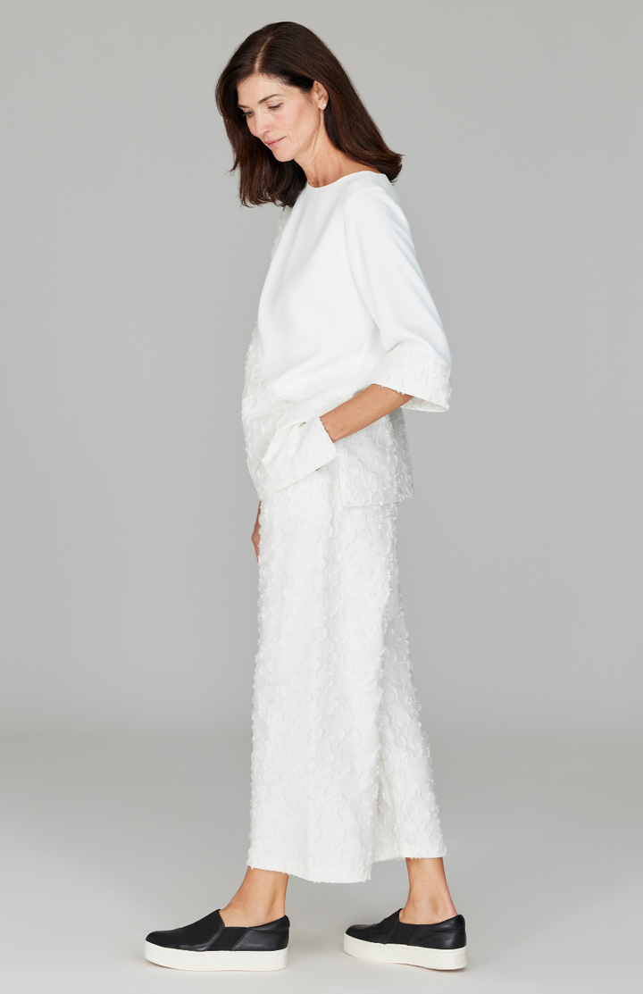 Ekaterina is 5'10" and wearing a size XS in Pearl.