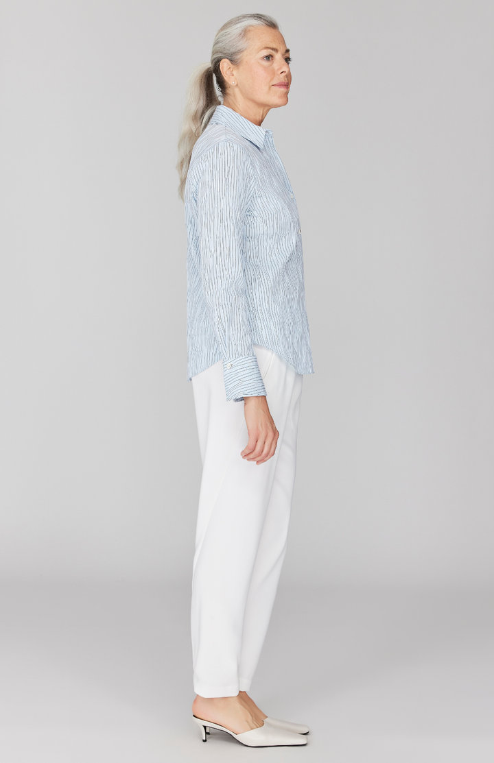 Fabienne is 5' 9" and wearing Blue in size XS.