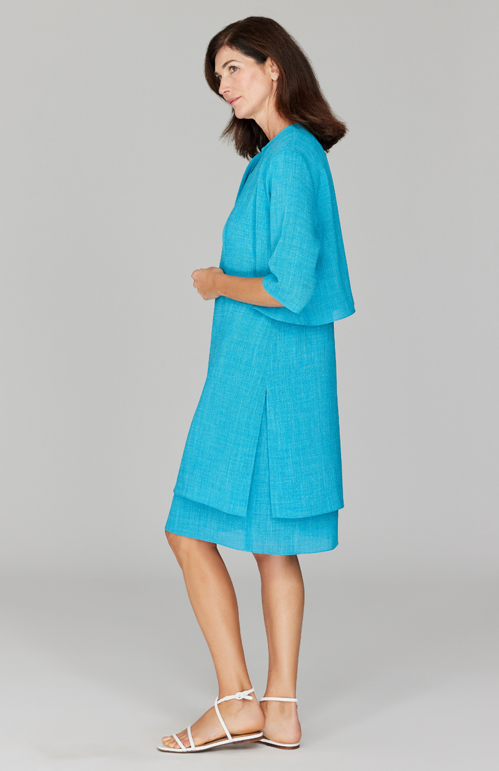 Ekaterina is 5'10" and is wearing a size XS in Cyan.