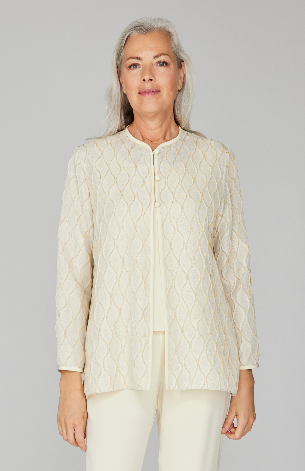 Fabienne is 5'10" and wearing Eggshell size XS.