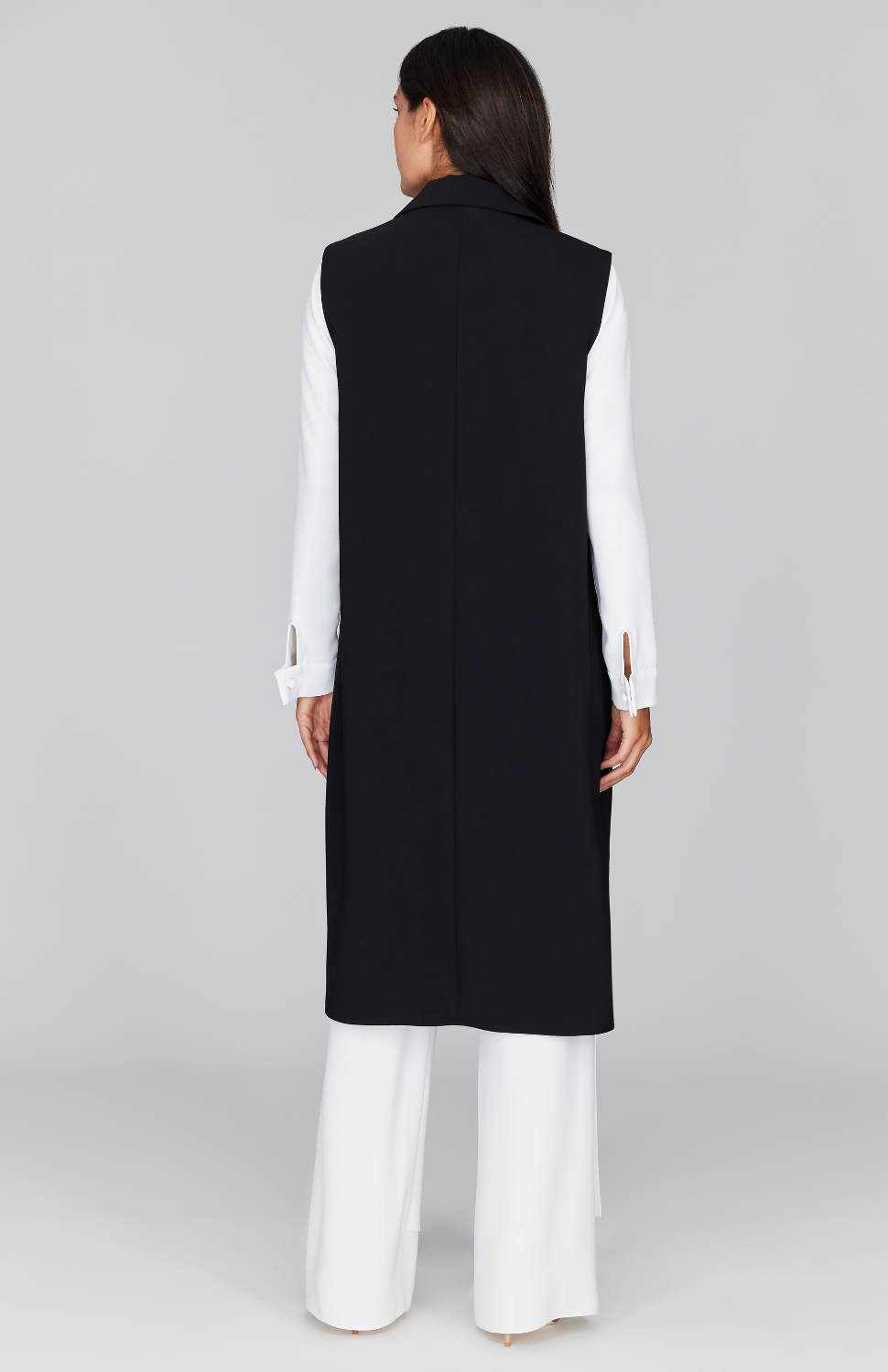 Chelsea is wearing Black in size XS.