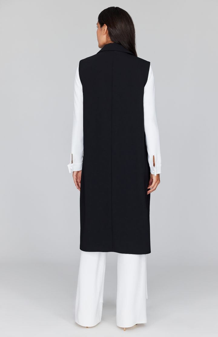 Chelsea is wearing Black in size XS.