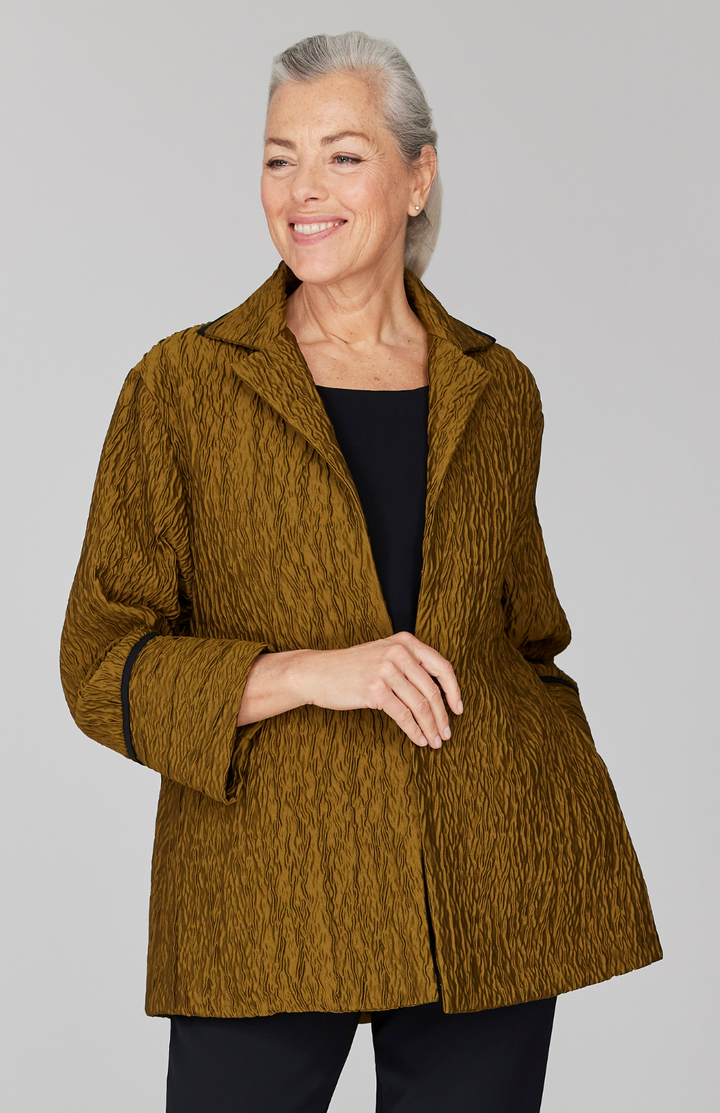 Fabienne is 5' 9" and wearing Gold in size XS.