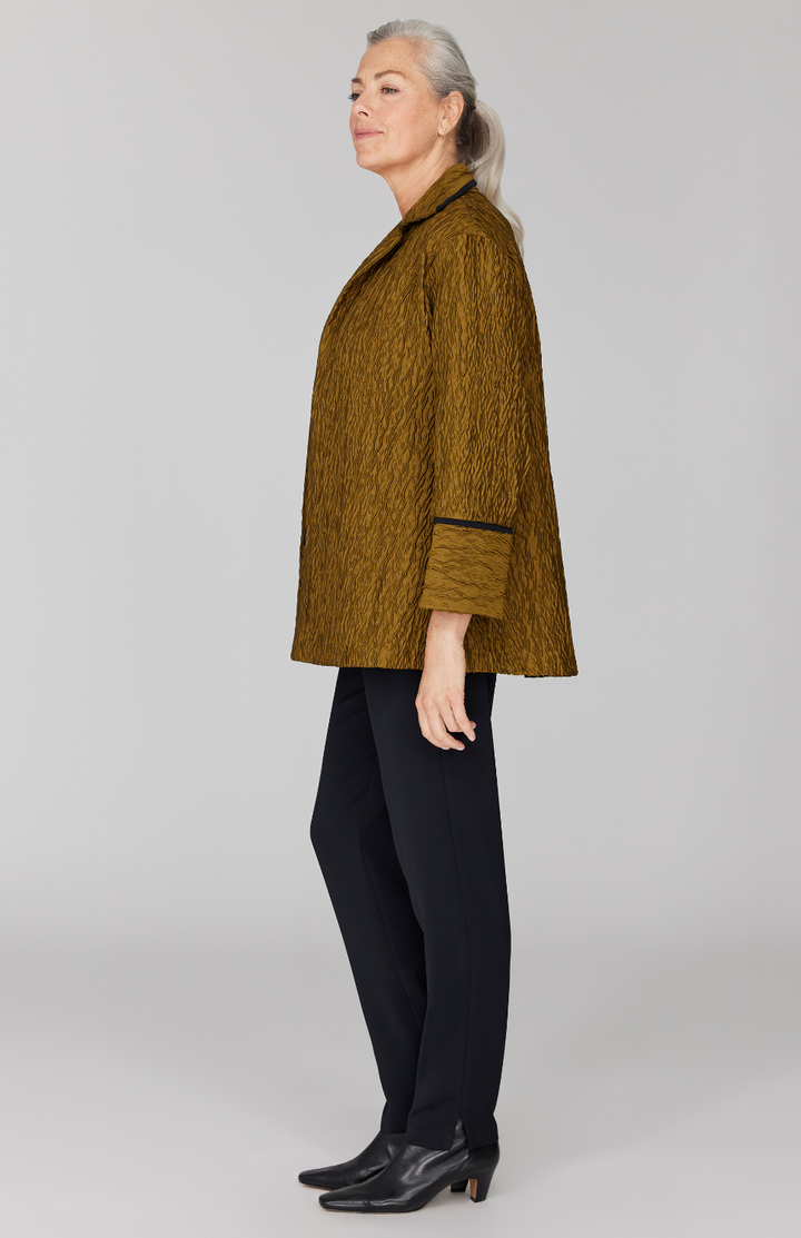 Fabienne is 5' 9" and wearing Gold in size XS.