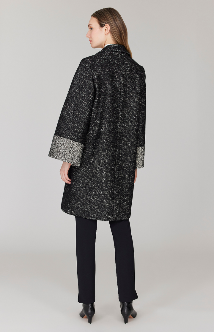 Morgan is 5' 11" and wearing Black and White in size XS.