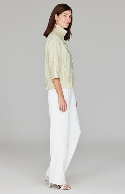 Ekaterina is 5'10" and wearing a size XS in Butter.