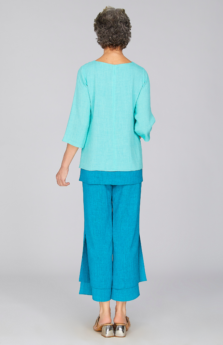 Nancy is 5'10" and wearing a size XS in Turquoise.