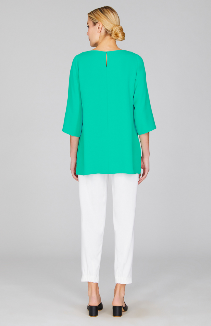 Gabby is 5'10" and wearing a size XS in Dark Mint.