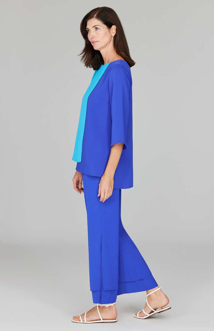 Ekaterina is 5'10" and wearing a size XS in Turquoise/Cobalt.