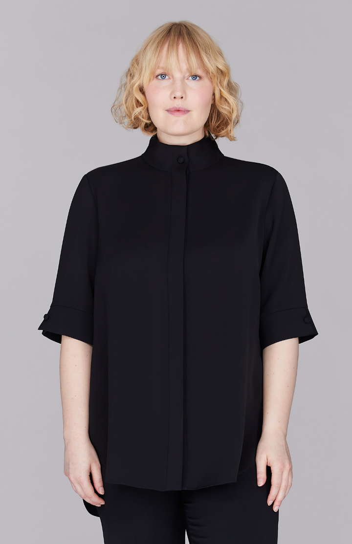 Molly is 5’ 8.5" and wearing Black in M.