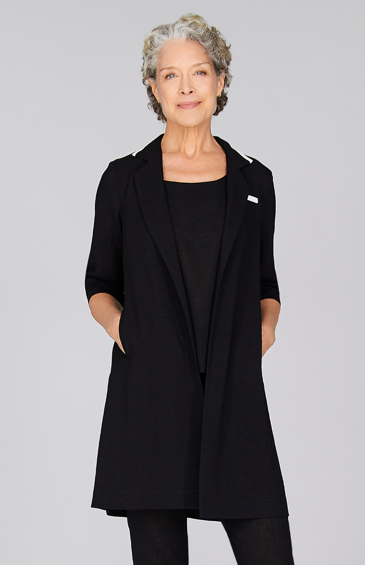 Nancy is wearing Black in size XS.