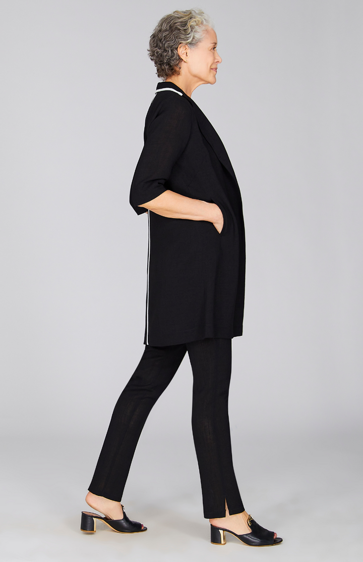 Nancy is wearing Black in size XS.