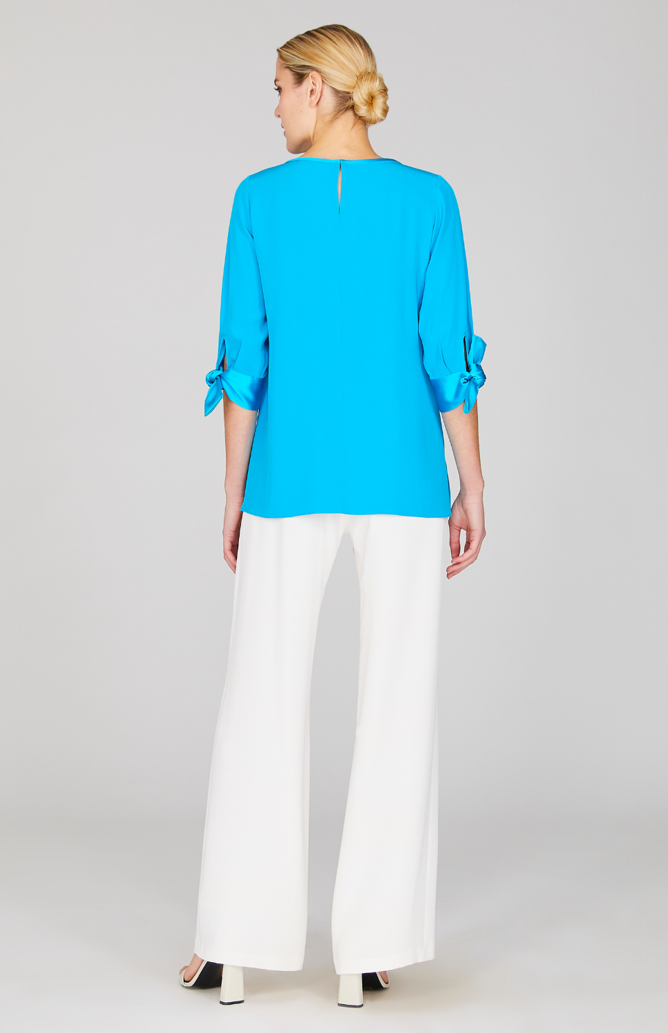 Gabby is wearing Cyan in size XS